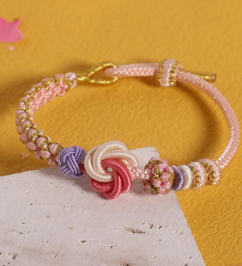 Bracelet avec noeud de fleurs de pêcher