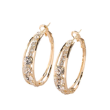 Grandes boucles d'oreilles créoles incrustées de strass
