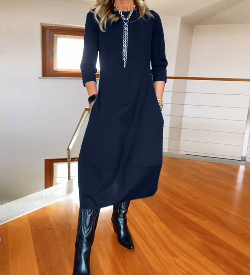 Robe élégante de couleur unie avec poche et col rond