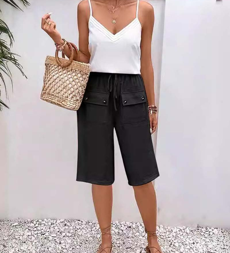 Pantalon mi-long décontracté avec poche de couleur unie