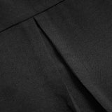 Haut décontracté à empiècements et boutons à sequins