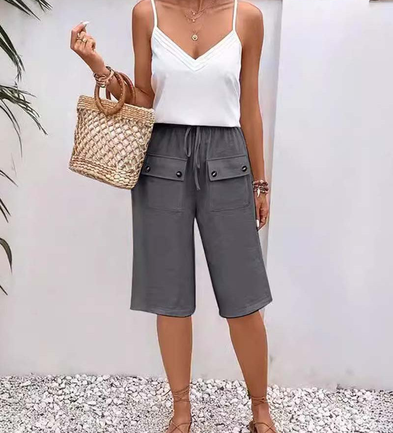 Pantalon mi-long décontracté avec poche de couleur unie